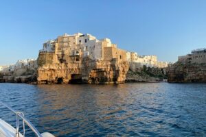 Boat excursion to Polignano a Mare between caves and coves - Stop 1: Statua di Domenico Modugno from the water